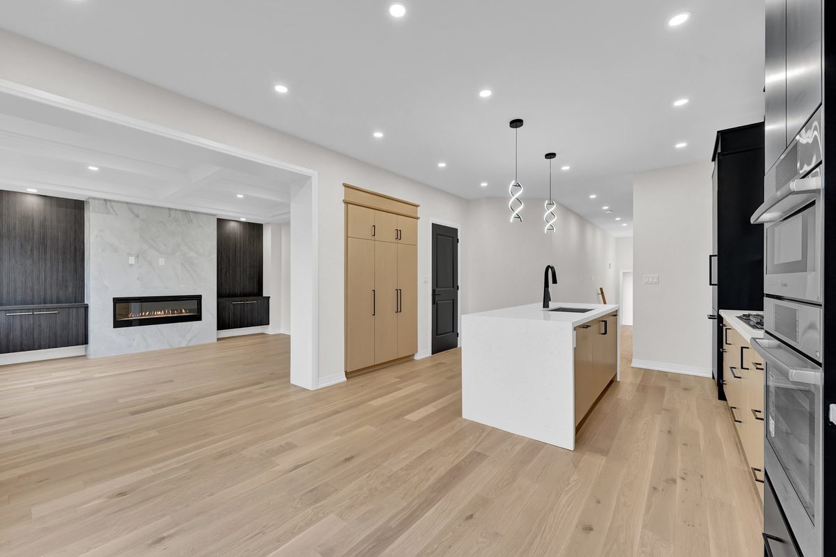 Open-concept main floor before staging, vacant